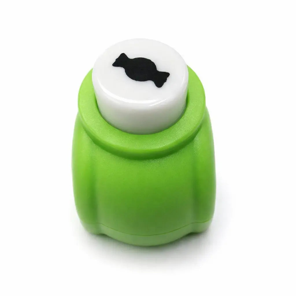 Perforatrice forme bonbon verte et bonbon en papier découpé