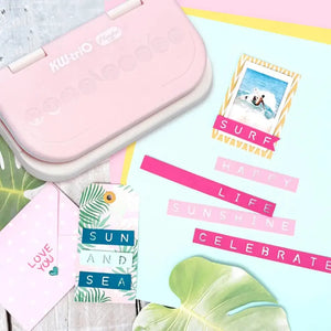 Mini-perforatrices de lettres alignées dans leur coffret