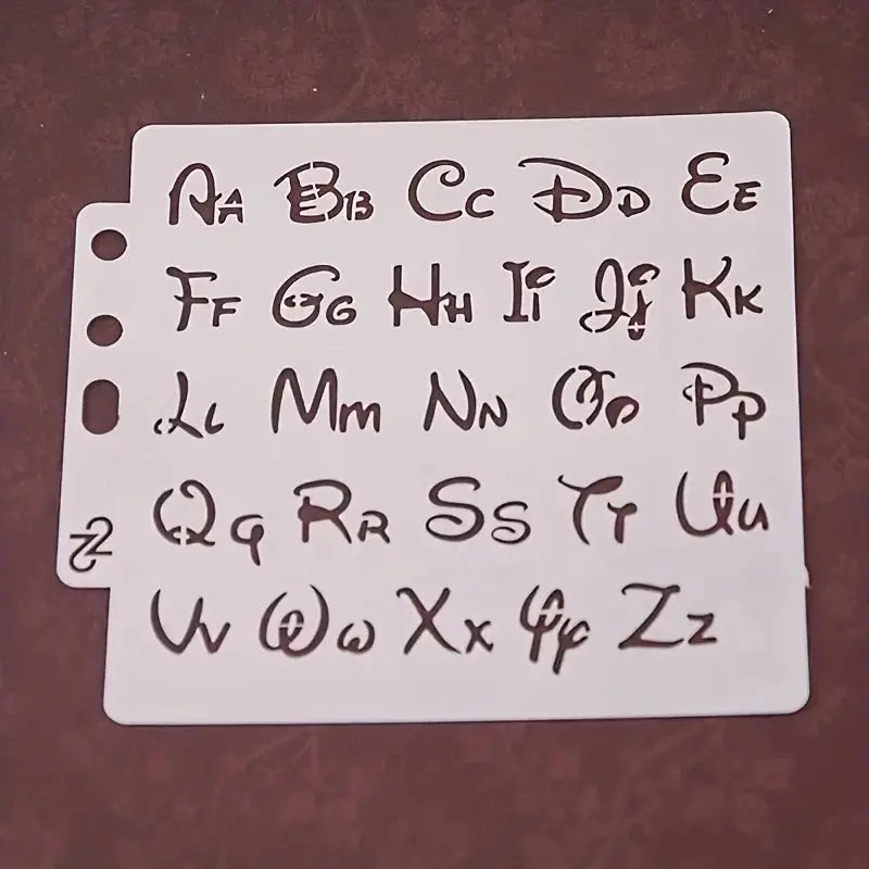 Pochoir alphabet style Disney bicasse, lettres cursives ondulées planche A6 ajourée perforée