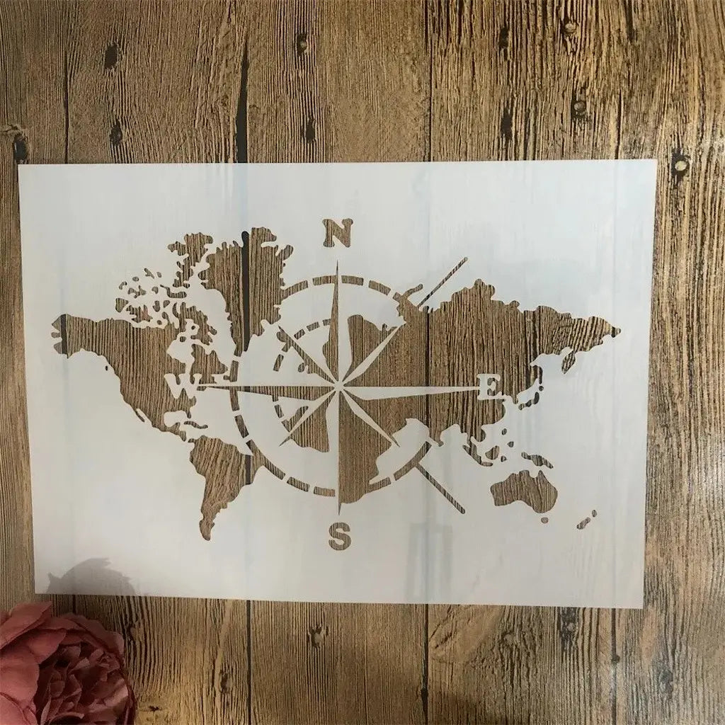 Pochoir carte du monde continents et rose des vents, format rectangle ajouré fond bois rustique