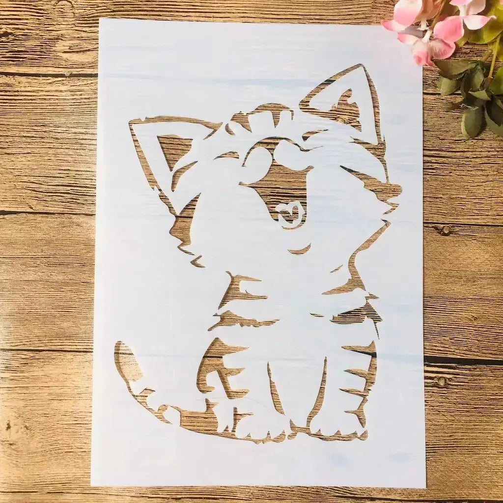 Pochoir chat chaton silhouette assis tête inclinée, oreilles dressées et queue enroulée ajouré