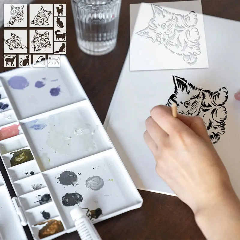 Pochoir chats peint en noir au pinceau, palette aquarelle multicolore en avant-plan