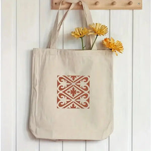 Pochoir frise florale carreau terracotta sur tote bag toile, fleurs jaunes en accent