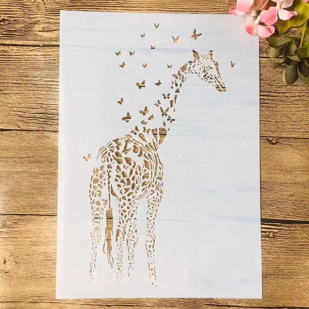 Pochoir girafe se dispersant en envol de papillons pour scrapbooking poétique