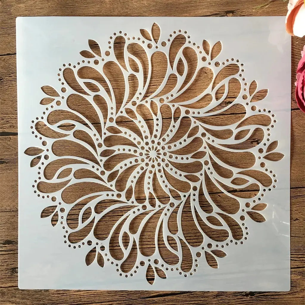 Pochoir mandala roue motif rosace tourbillonnante feuilles et perles, format carré ajouré