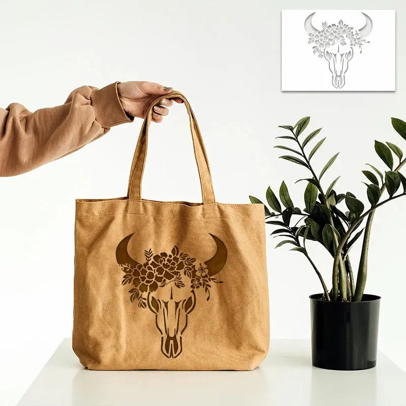 Pochoir Taureau peint en or sur sac en toile naturelle