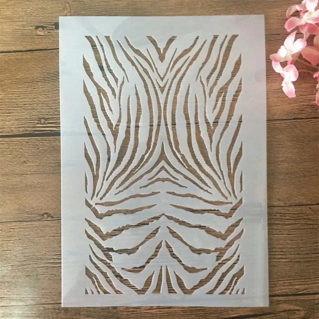 Pochoir tigre A4 motif rayures fauves symétriques verticales, planche rectangulaire ajourée