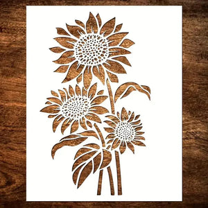 Pochoir tournesol trois fleurs en bouquet sur tige feuillée, format vertical ajouré sur bois