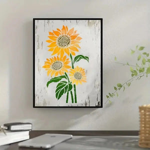 Pochoir tournesol trois fleurs jaunes encadrées sur fond bois patiné, bureau lumineux décor