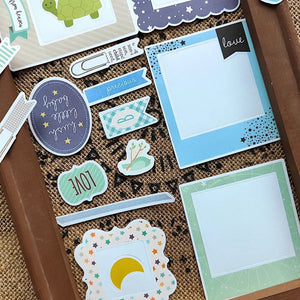 Cadres et cartes photo du lot bébé scrapbooking, à intégrer sur une page de souvenirs