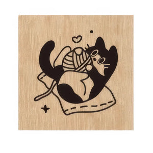 Tampon scrapbooking Animaux, chat noir jouant avec une pelote