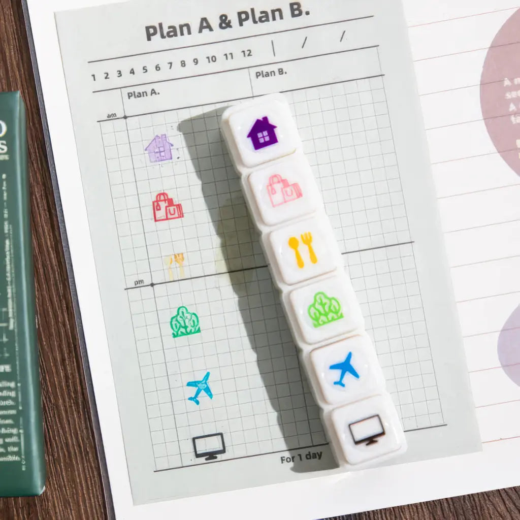 Tampon scrapbooking École, pictos maison et voyage sur une grille d'agenda