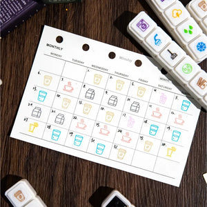 Tampon scrapbooking École, pictos boissons remplissant un calendrier mensuel