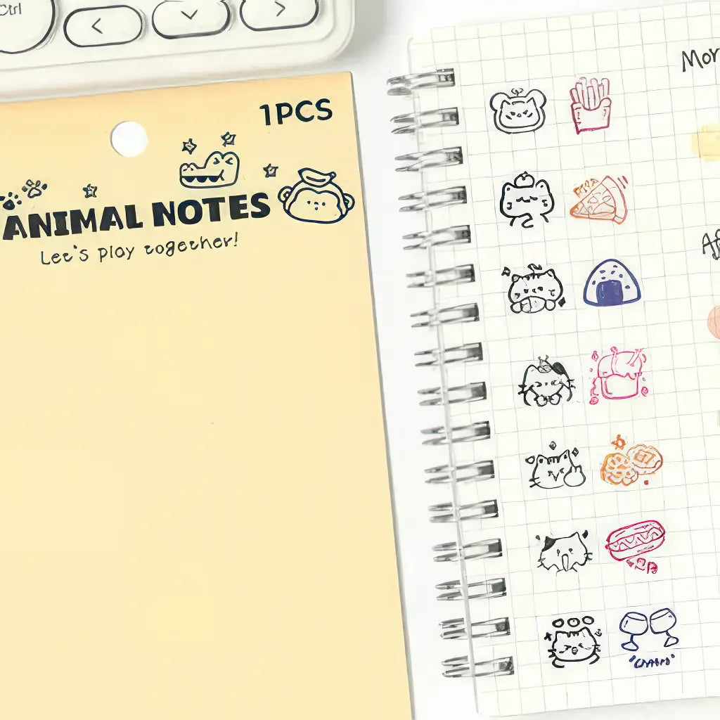 Tampon silicone scrapbooking, planche animaux et empreintes sur un carnet à spirale